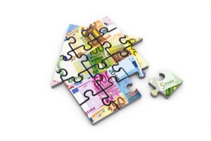 Home value heaven - house shaped puzzle of euro money estate loan money home