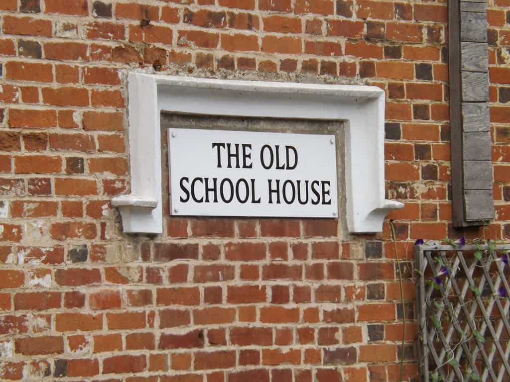 Don't Underestimate Your Exterior: Simple Ways To Add Serious Curb Appeal #CurbAppeal #FrontExterior #HomeImprovements #Hampers&Hiccups Serious Curb Appeal brick front exterior of the old schoolhouse