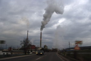 Indoor air quality affected by outdoor pollution in the air street factory smoke view
