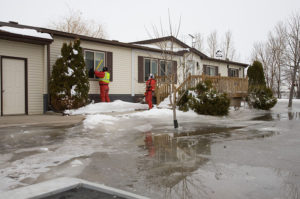 Winter home checks FEMA inspecting a home with ice flood damage in Minnesota
