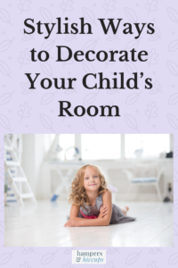 Stylish Ways to Decorate Your Child’s Room a girl on the floor of her bedroom smiling hampersandhiccups