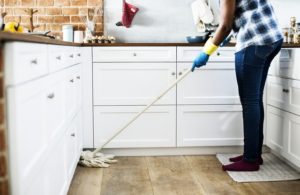  Cleaning the home easier woman mopping a kitchen