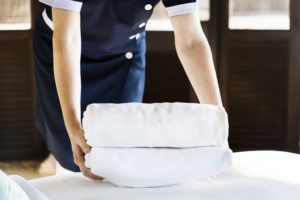  Cleaning the home easier woman with folded sheets