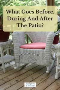 What goes before, during and after the patio? Wicker rocking chair and end tables with potted plants on wood decking patio hampersandhiccups