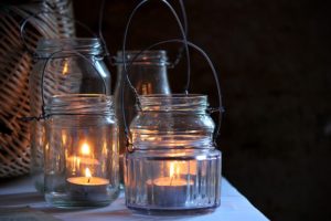 Rustic garden glass jars with lit candles