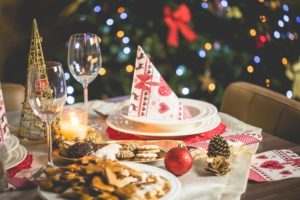 Festive Traditions holiday baking cookies and treats to eat with water glasses and decorative napkins