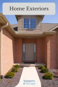 Home Exteriors front walkway and door of home with brick exterior landscaping hampersandhiccups