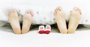 Now you are pregnant parents feet baby feet in bed