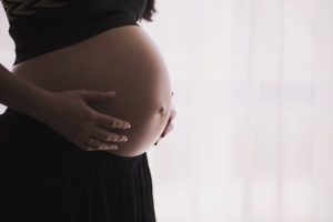 Now you are pregnant woman holding pregnant belly