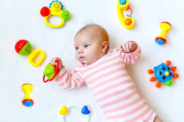 infant-with-toys