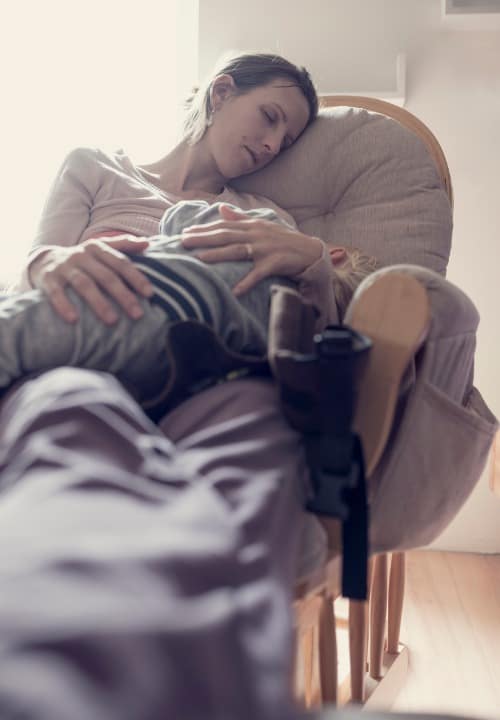 mom-rocking-baby-in-daytime-nap