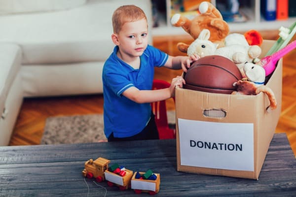 child-sorting-old-toys