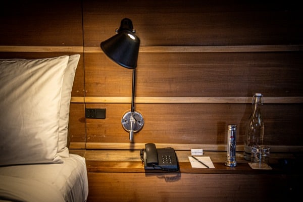 lighting-bedside-lamp-by-the-wooden-wall