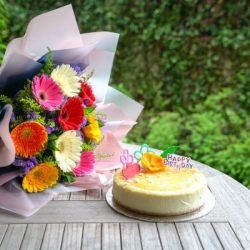 birthday-cake-with-bouquet-of-colorful-gerbera-daisies
