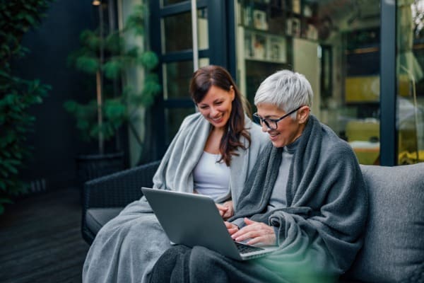 family-time-mother-and-daughter-looking-at-laptop