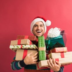 handsome man with presents during christmas