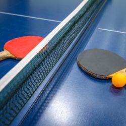 ping pong table tennis bats and ball
