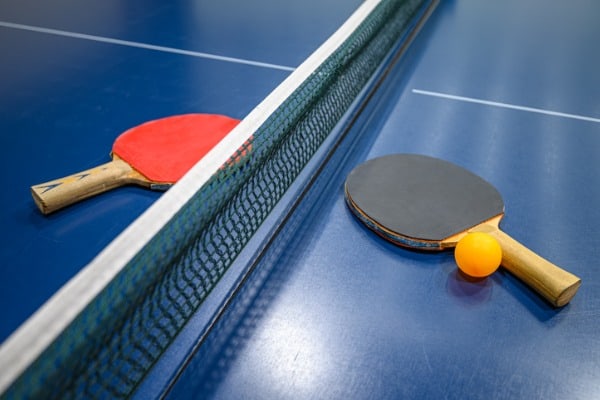 ping pong table tennis bats and ball
