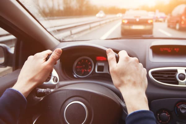 traffic jam driving car on highway close up of hands
