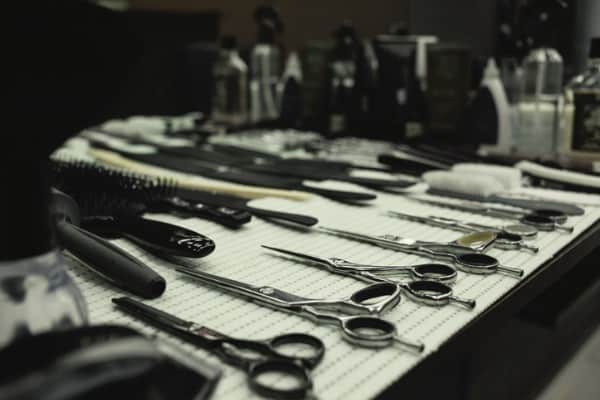 barbers work table with a set of scissors