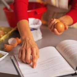 closeup on happy housewife preparing christmas dinner in
