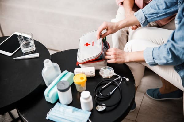 female doctor opening medical first aid