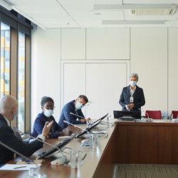 business people working in masks