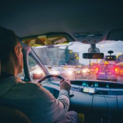 driving a car in the city at night in traffic jams