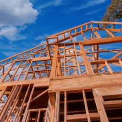 home new stick built home under construction a blue sky