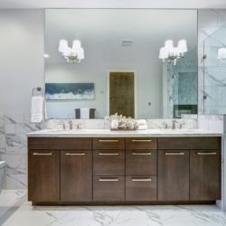 incredible master bathroom with carrara marble tile surround