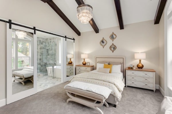 master bedroom in new luxury home with chandelier