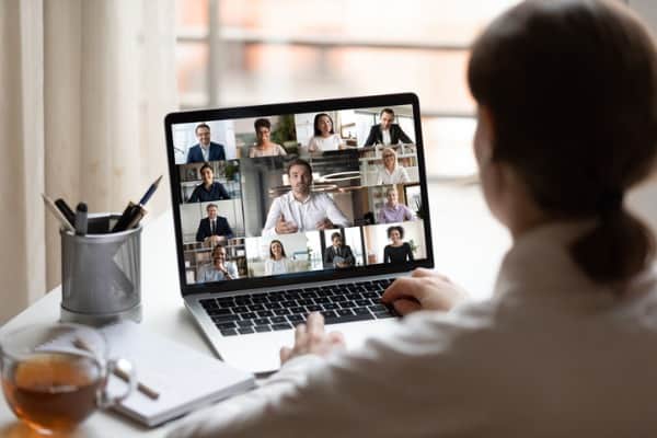 on laptop diverse people collage webcam view over woman shoulder