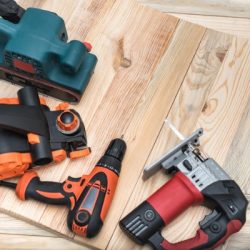 set of handheld woodworking power tools for woodworking on light
