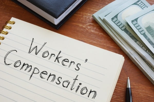 workers compensation is shown on the conceptual business photo