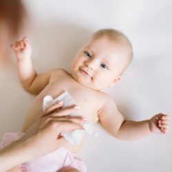 baby changing using wet wipes
