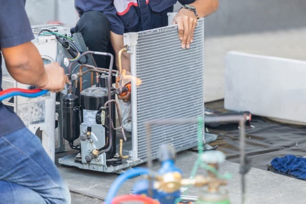 close up of air conditioning repair team use fuel gases and oxygen