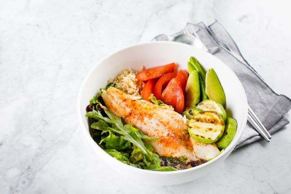 healthy salad fish bowl zander vegetables green leaves avocado tomato