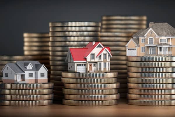 houses of different size with different value on stacks of coins