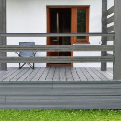 part of white residential house with dark gray composite material