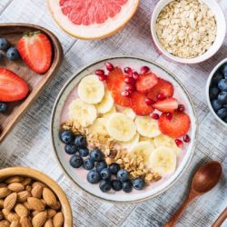smoothie bowl with banana strawberry blueberry granola