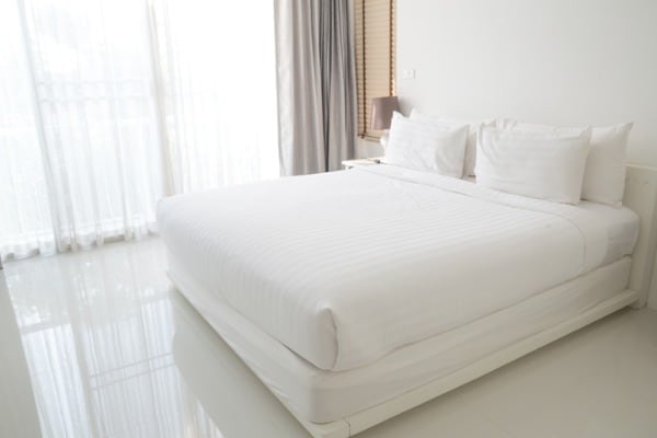 white bed sheets and pillows