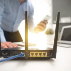 wireless router concept man using smartphone